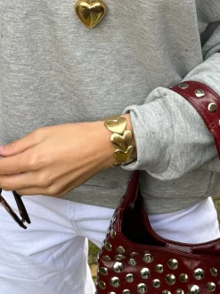 Embrace armband gold